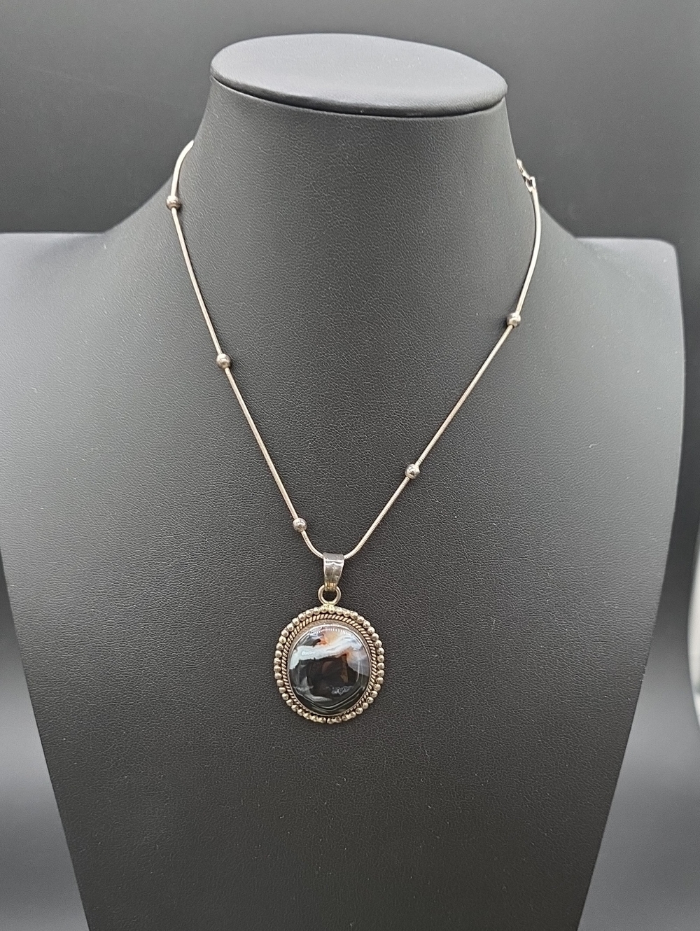 925 silver station necklace featuring a round banded agate pendant